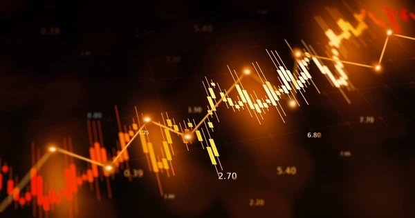 Stock chart with orange and yellow candlesticks on a dark background, highlighting AI-driven website development trends.