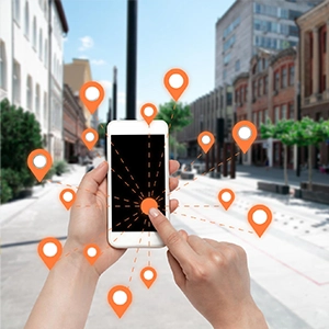 Person navigates city street using smartphone with location markers, highlighting modern SEO and web design services.